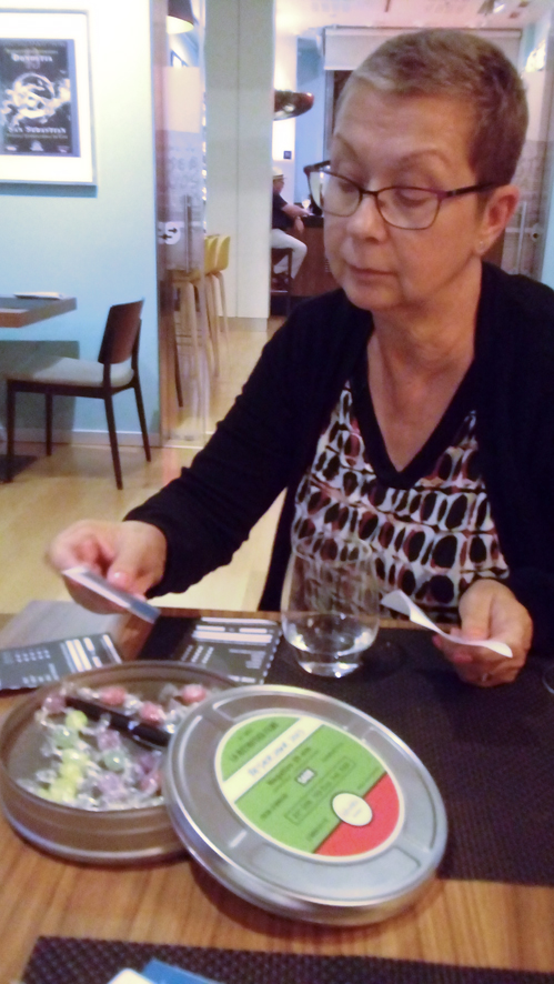 Dee with film tin bill