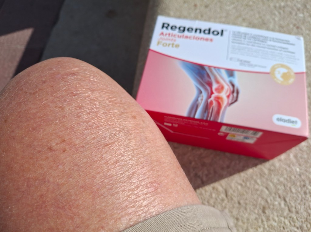 Close-up of a person's knee with visible skin texture, next to a box of Regenidol Forte, which highlights joint health.